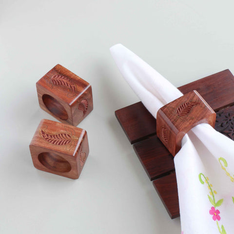 Paisley wooden napkin rings with brass inlay styled on a dining table for an elegant table setting decor