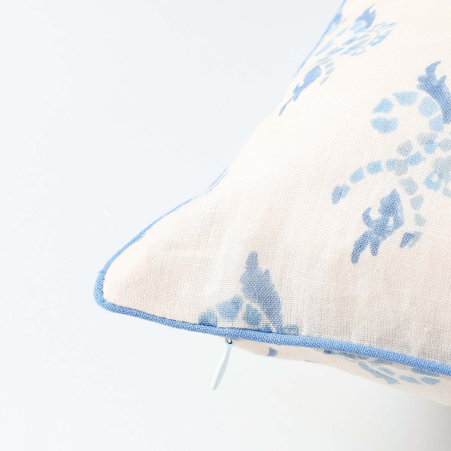 Detailed blue swirl hand block print on peach cotton linen fabric showcasing artisan craftsmanship