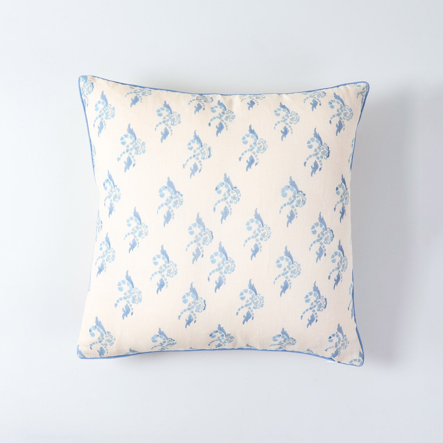 Premium cotton linen cushion cover featuring traditional block printed swirl design in peach and blue 