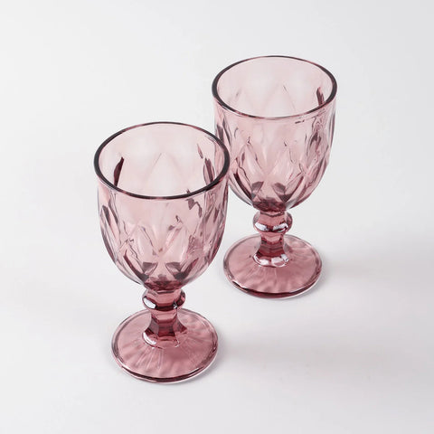 Set of two pink diamond wine glasses displayed against a clean background highlighting handcrafted glasswork