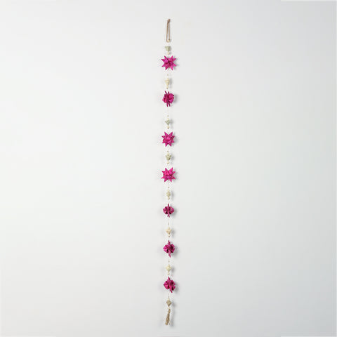 Decorative bead and pearl accents on a pink floral door hanging