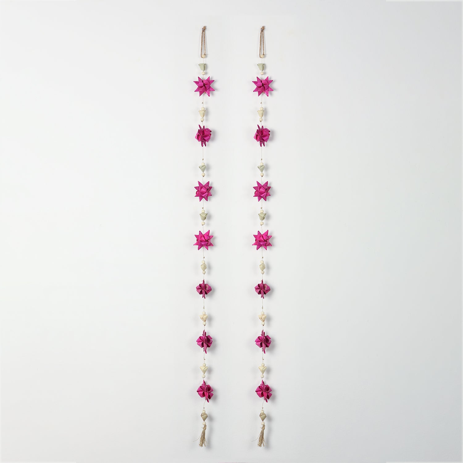 Full view of pink origami-style flower door hanging with decorative beads