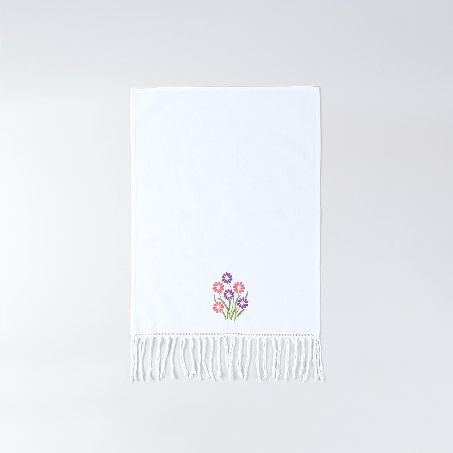 Full size white cotton kitchen hand towel featuring colourful daisy embroidery and handcrafted detailing