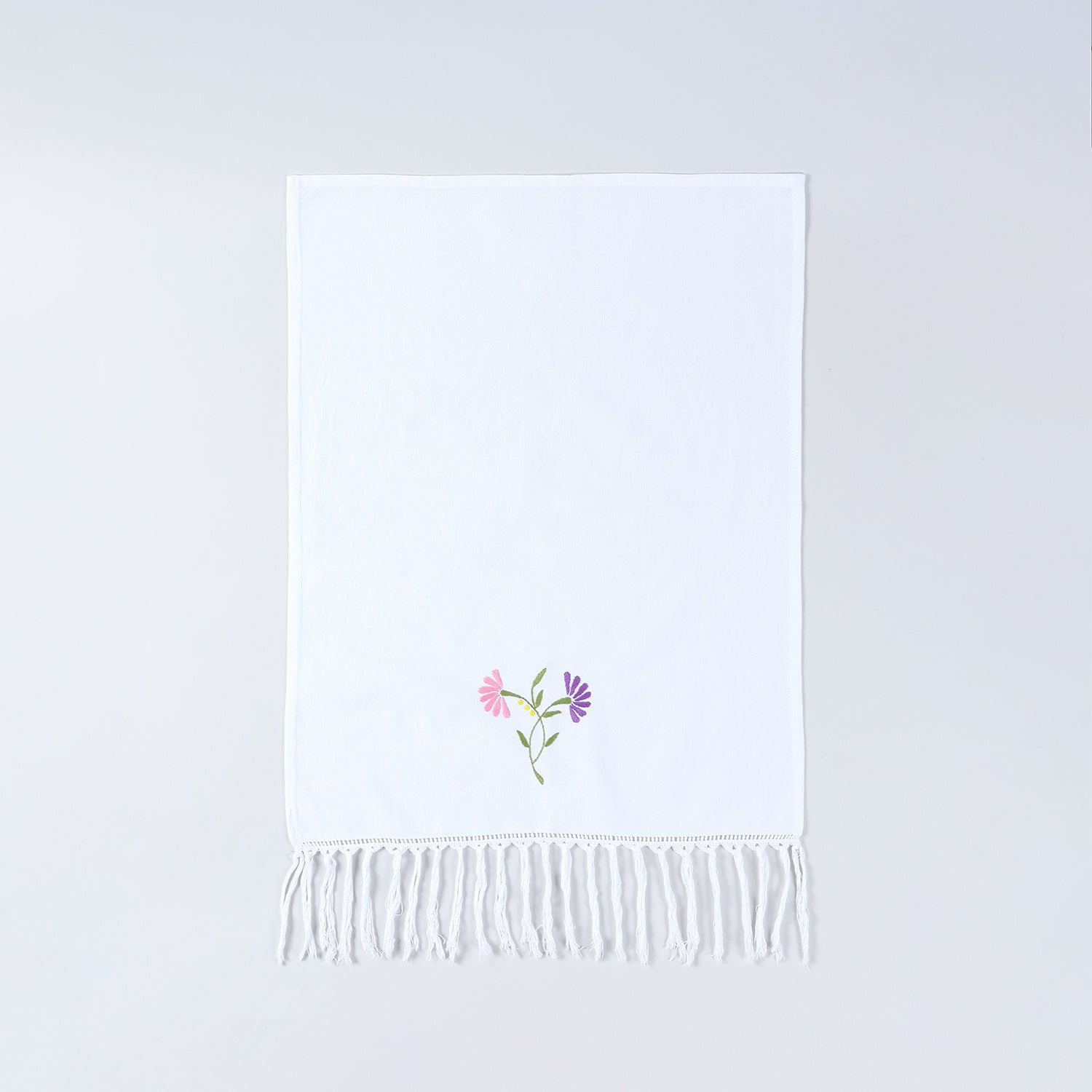 Full size white cotton kitchen hand towel featuring floral chikankari embroidery and decorative tassel border