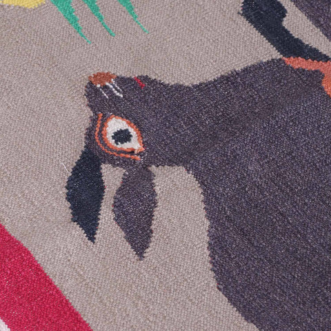 Close-up of rabbit and peacock motifs highlighting intricate handwoven cotton craftsmanship and folk-inspired detailing