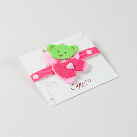 Angled view of the handmade pink Teddy Bear Felt Kids Rakhi attached to a festive Best Wishes card for Raksha Bandhan gifting