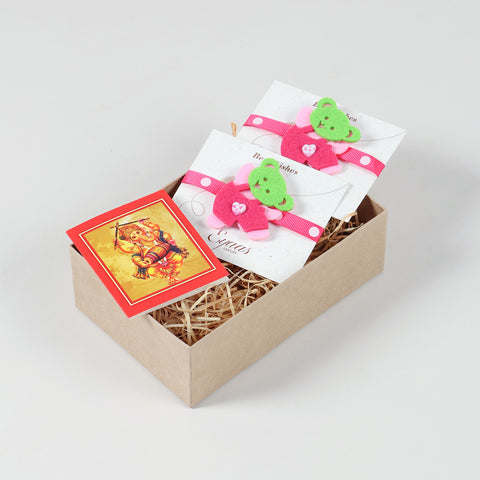Open gift box featuring the handmade Pink Teddy Bear Felt Kids Rakhi, ready for festive gifting.