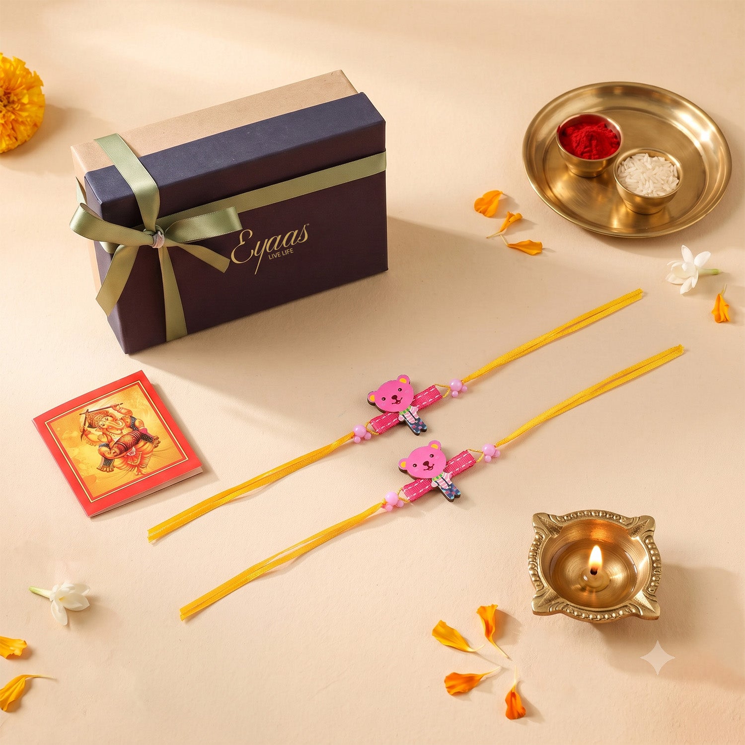 Handmade Pink Teddy Bear Wooden Kids Rakhi Set of 2, beautifully presented in a festive gift box with  yellow satin ribbon, ready for Raksha Bandhan gifting.