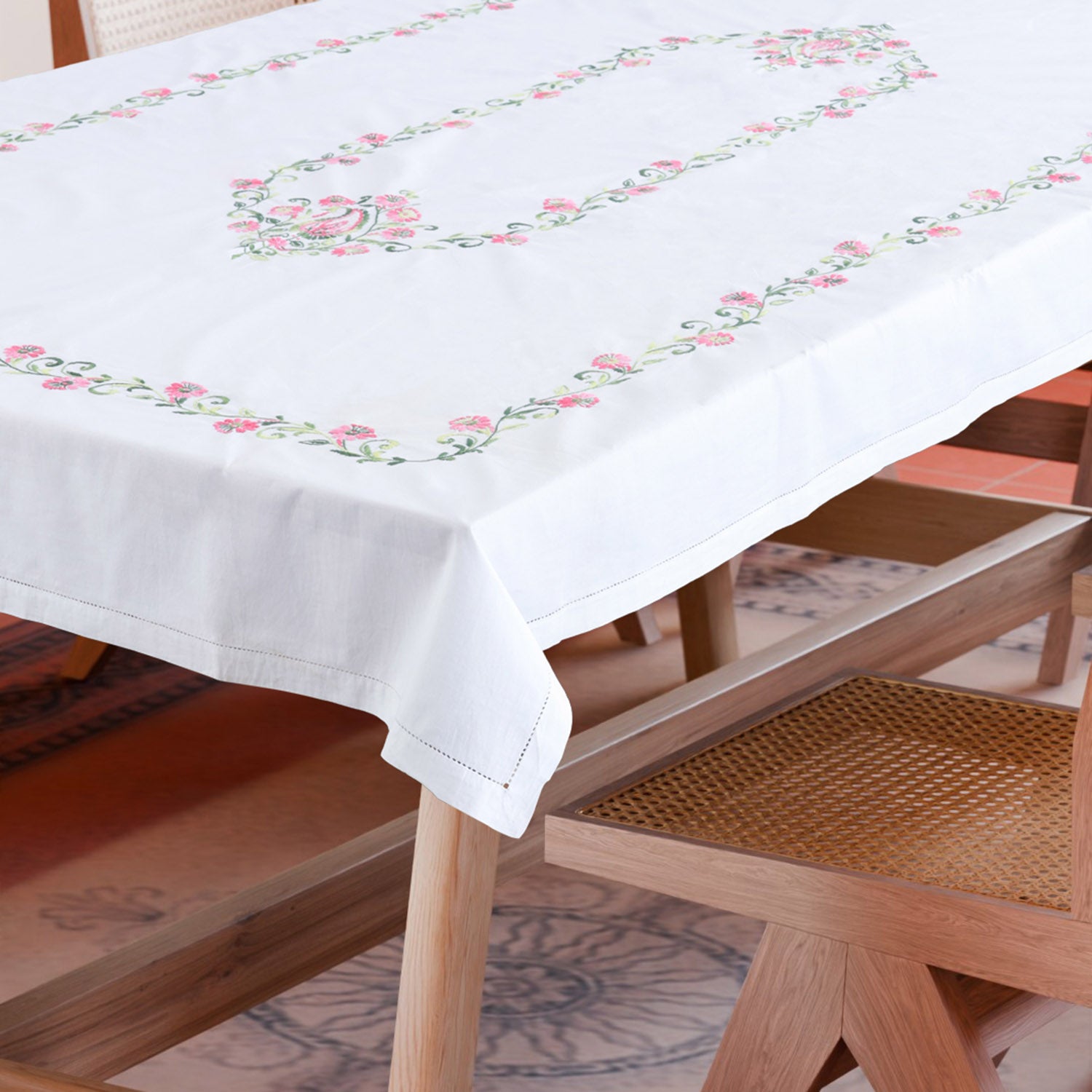 Rangoon creeper embroidered cutwork table cloth styled on a dining table for elegant dining table decor and entertaining