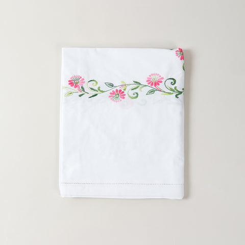 Folded Bengal chikankari embroidered table cloth showcasing floral cutwork and hand embroidery details