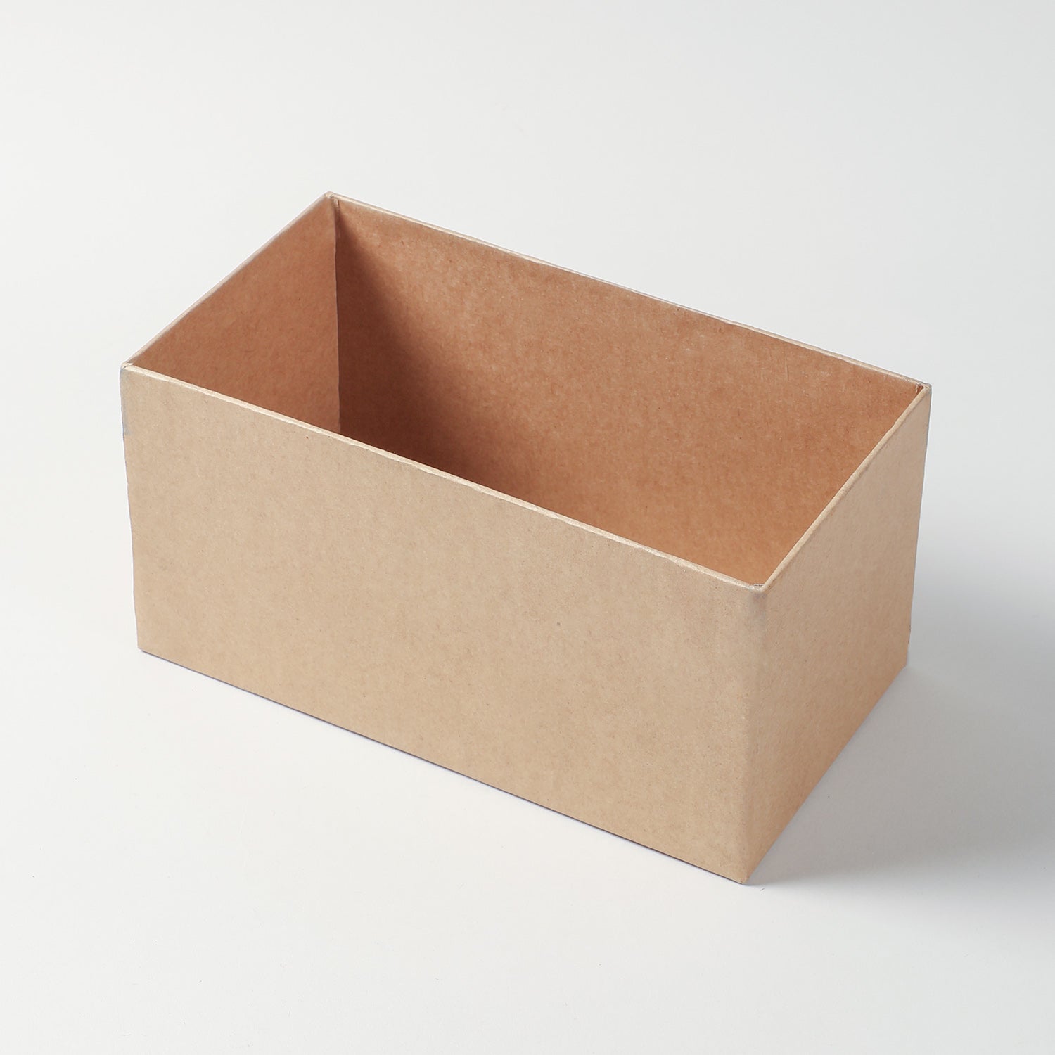 Open rectangular gift box with the bamboo lid lifted to show the interior