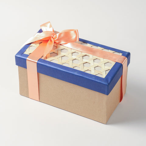 Rectangular cardboard gift hamper box with a woven bamboo lid and blue border