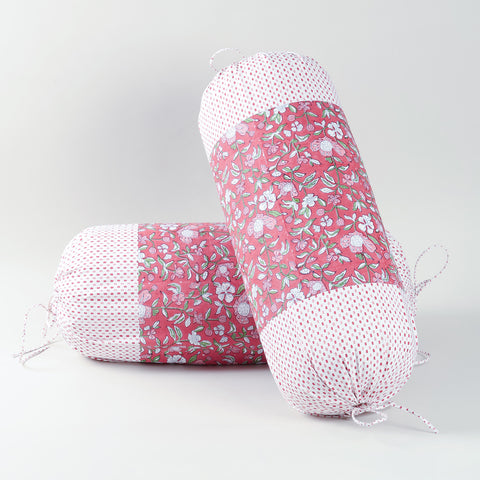 Set of two red hand block-printed cotton bolster covers featuring traditional patterns and artisanal craftsmanship