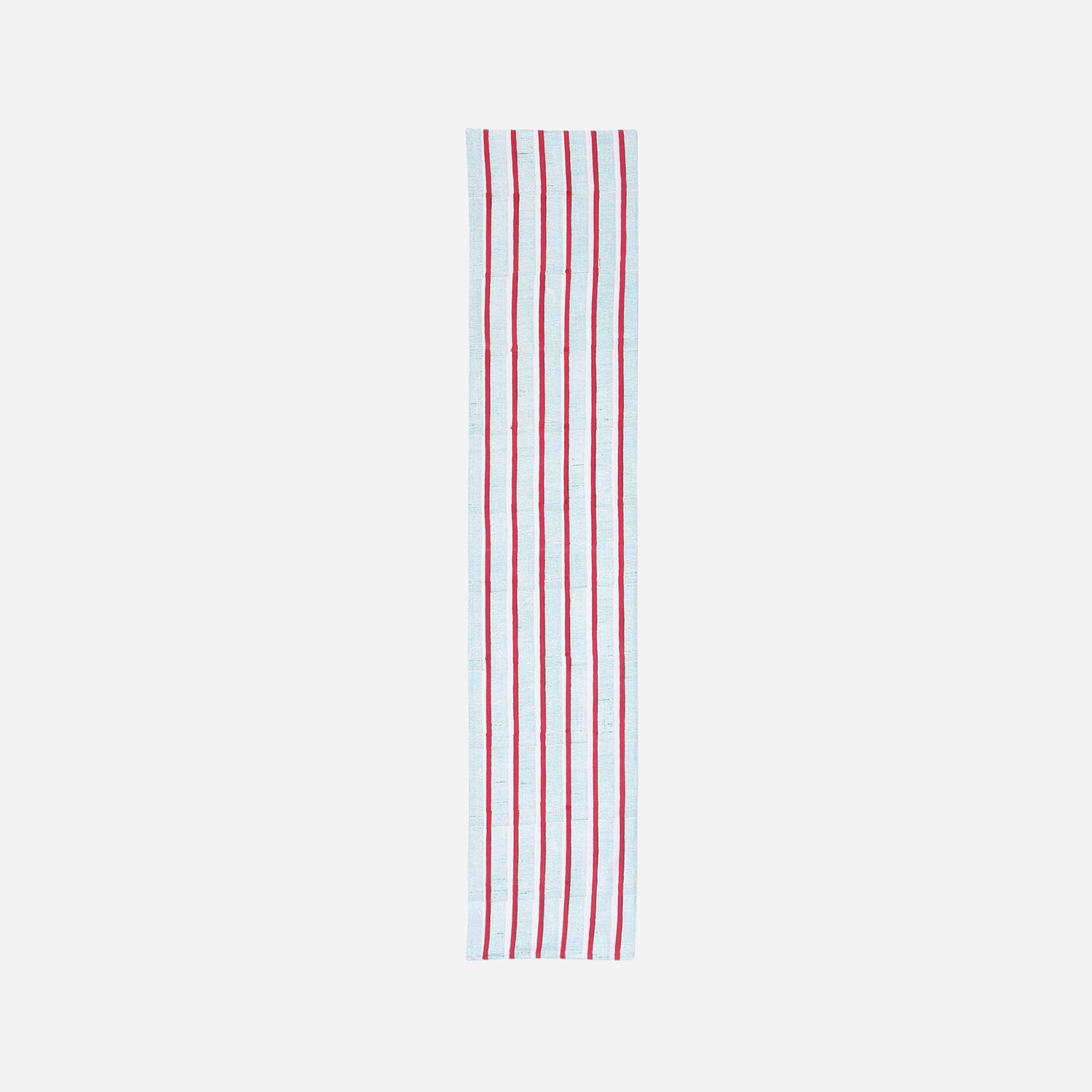  Full-length cotton table runner featuring red and green hand block printed stripe patterns on a white base, displayed on a plain background