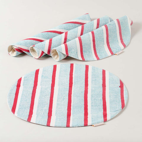 Set of four handmade cotton placemats with red and green stripe block print designs showcasing artisan craftsmanship and cotton table linen quality