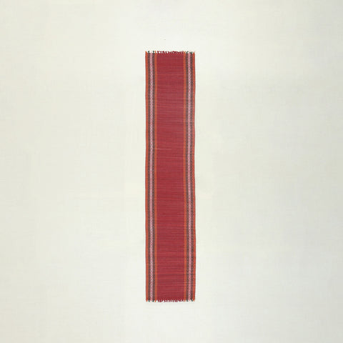 Full-length handmade red Madhurkathi table runner crafted from natural river grass, ideal for dining table decor and table settings