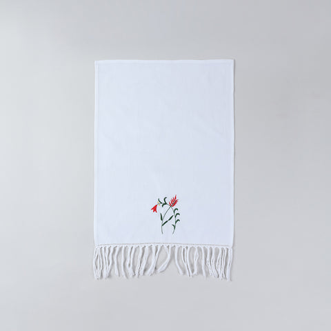Full size white cotton kitchen hand towel with handcrafted floral embroidery and decorative tasselled border