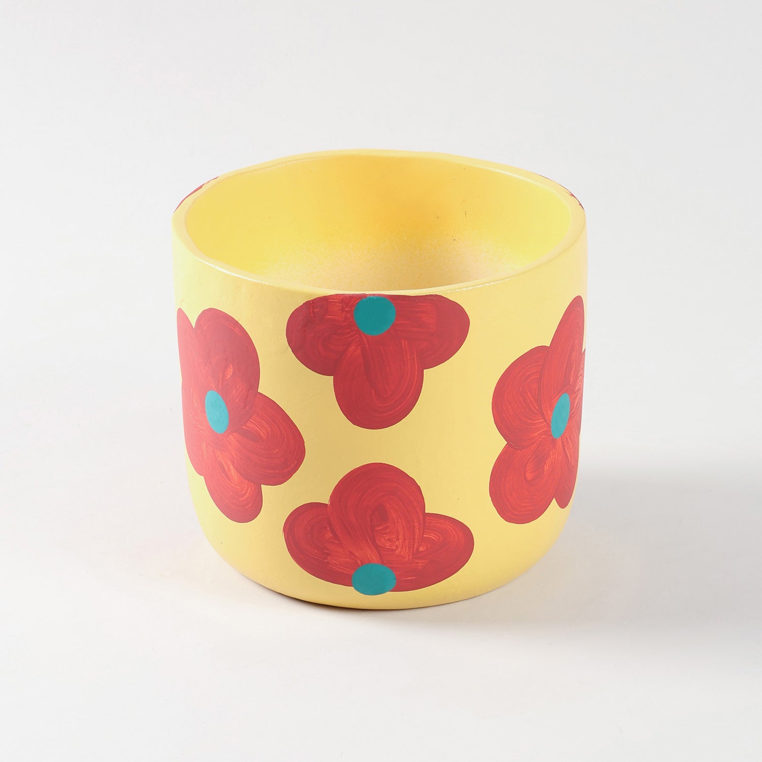 Large yellow ceramic flower pot with retro floral hand-painted design, smooth glazed finish, and wide cylindrical shape for indoor plants.
