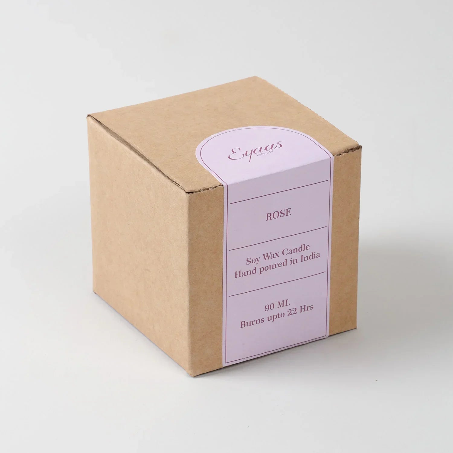 Rose scented soy wax candle in decorative glass with gift box displaying fragrance and burn time details