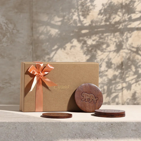 Rosewood coaster gift set with tiger brass inlay, beautifully styled as a festive gift with gift box and elegant presentation