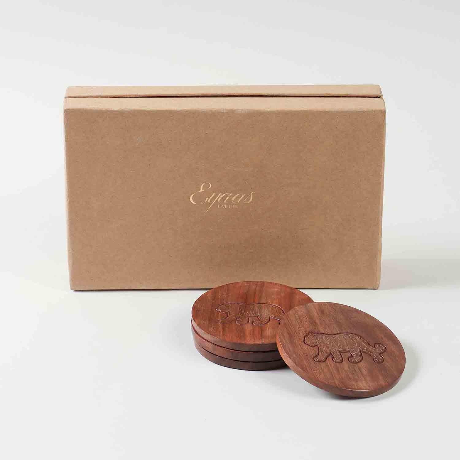 Handcrafted rosewood coaster set with tiger brass inlay, presented as a premium corporate gift in a decorative gift box
