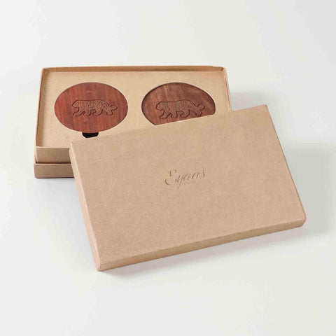 Premium gift presentation of handcrafted rosewood coasters with tiger brass inlay arranged in a decorative gift box for special occasions