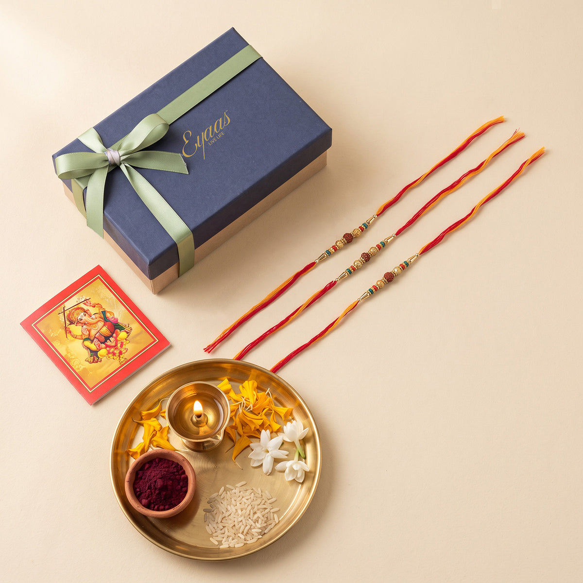Handmade Rudraksha & Metal Bead Rakhi for Brothers Set of 3, beautifully presented in a festive gift box for Raksha Bandhan gifting.