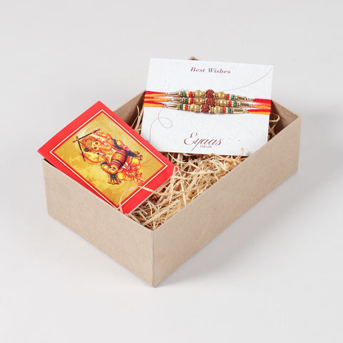 Handmade Rudraksha & Metal Bead Rakhi Set of 3 carefully arranged inside a festive Raksha Bandhan gift box.
