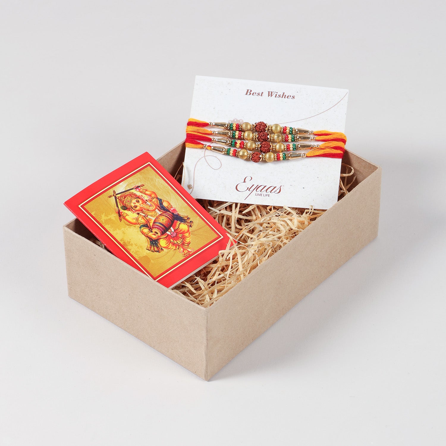 Handmade Rudraksha & Metal Bead Rakhi Set of 4 neatly arranged inside a decorative Raksha Bandhan gift box.