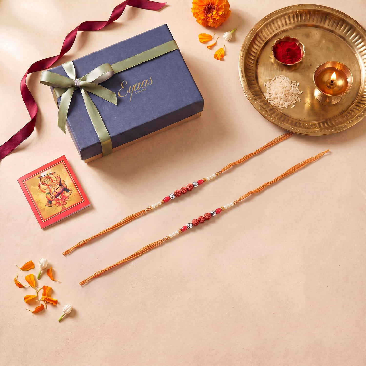 Rudraksha with red and pearl bead rakhi set of 2 for brothers with cotton thread, beautifully presented in a festive gift box for Raksha Bandhan gifting.