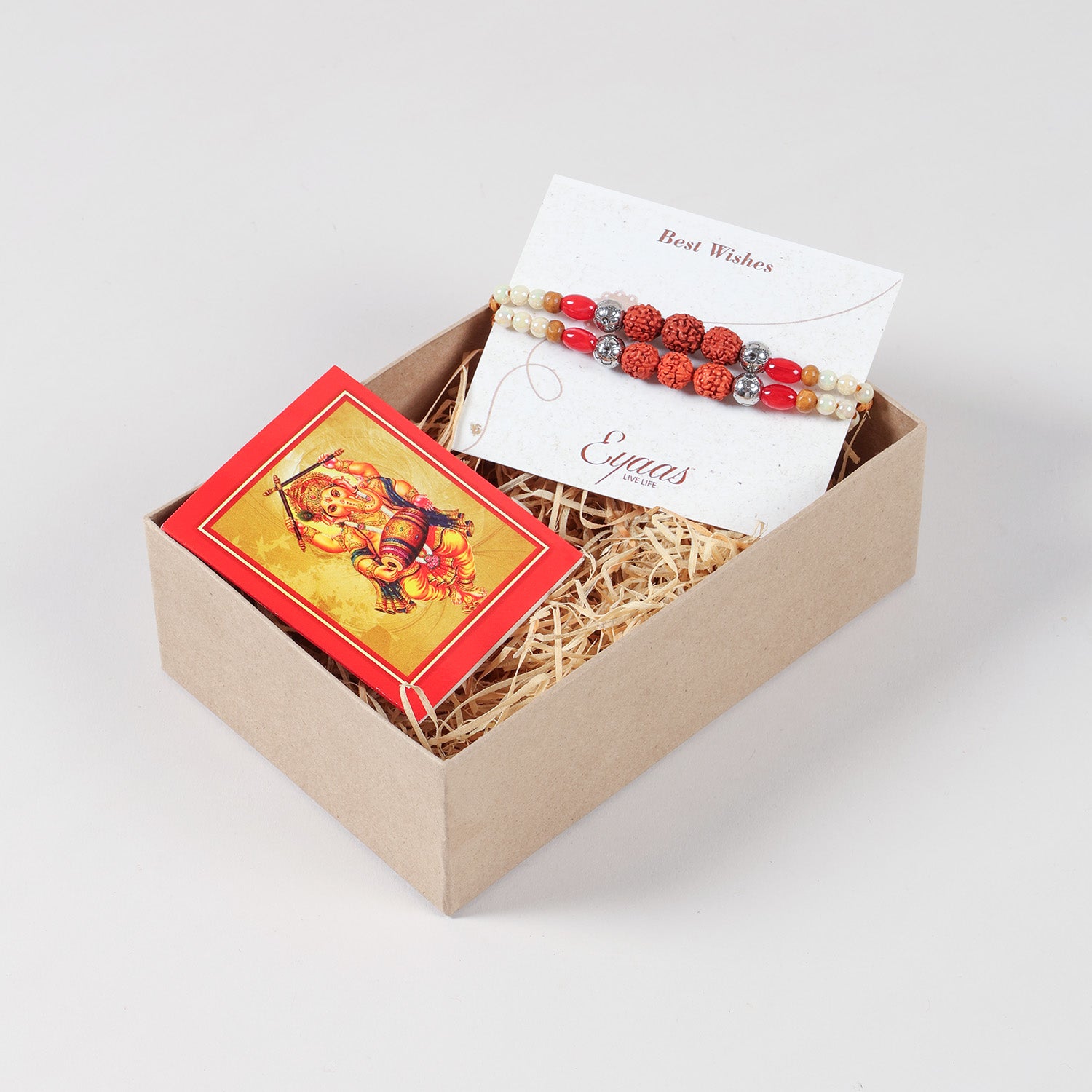 Handmade Rudraksha with Red and Pearl Bead Rakhi Set of 2 neatly arranged inside a decorative Raksha Bandhan gift box.