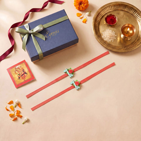 Set of 2 Giraffe Wooden Kids Rakhi, packed in a red ribbon gift box for Raksha Bandhan gifting.
