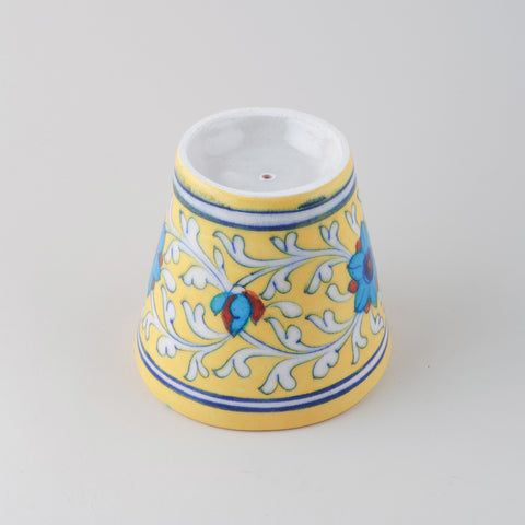 Upside down conical Blue Pottery flower pot showing drainage hole