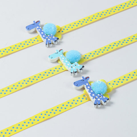 Close-up of the handmade Set of 3 Giraffe Wooden Kids Rakhi with yellow ribbon and giraffe design.