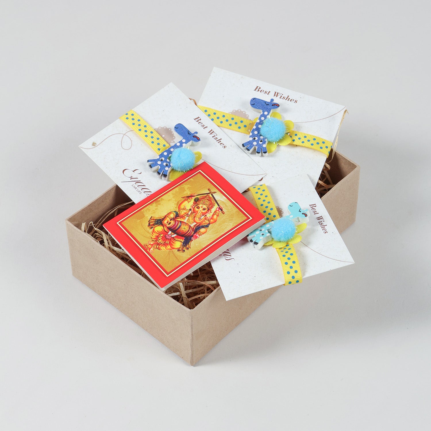 Set of 3 Giraffe Wooden Kids Rakhi arranged inside a Raksha Bandhan gift box