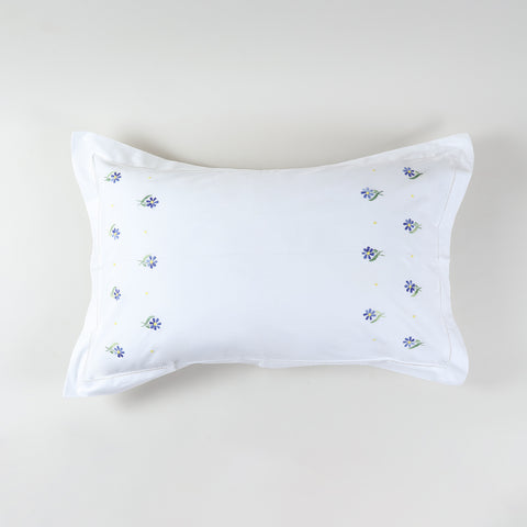 White cotton pillow case decorated with Forget-me-not flower embroidery in lavender and green tones