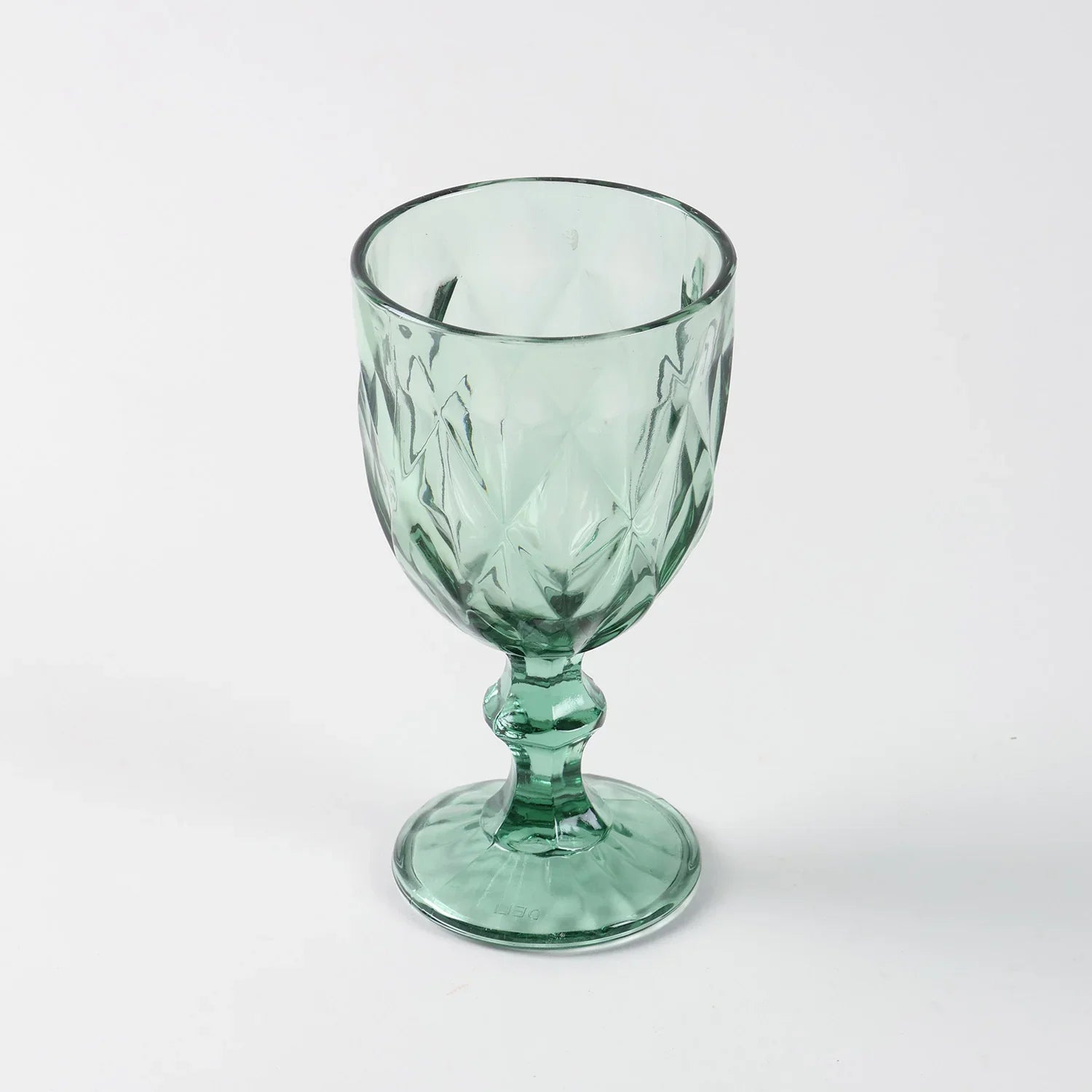 Front view of a single green diamond wine glasses highlighting shape finish and handcrafted detailing