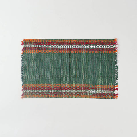 Single handmade green Madurkathi placemat crafted from natural river grass, ideal for dining table décor and everyday use