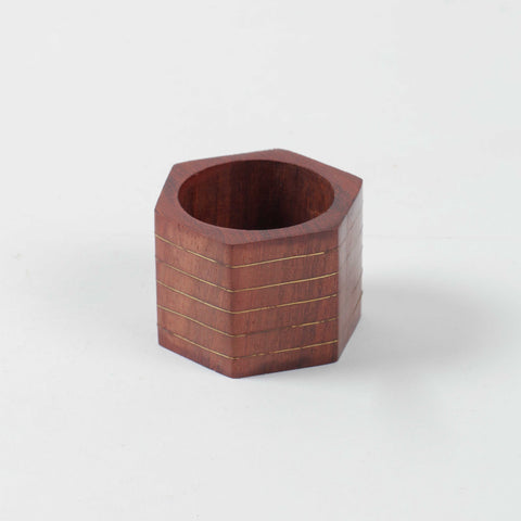 Hexagon wooden napkin ring with striped brass inlay, crafted using traditional Tarkashi techniques