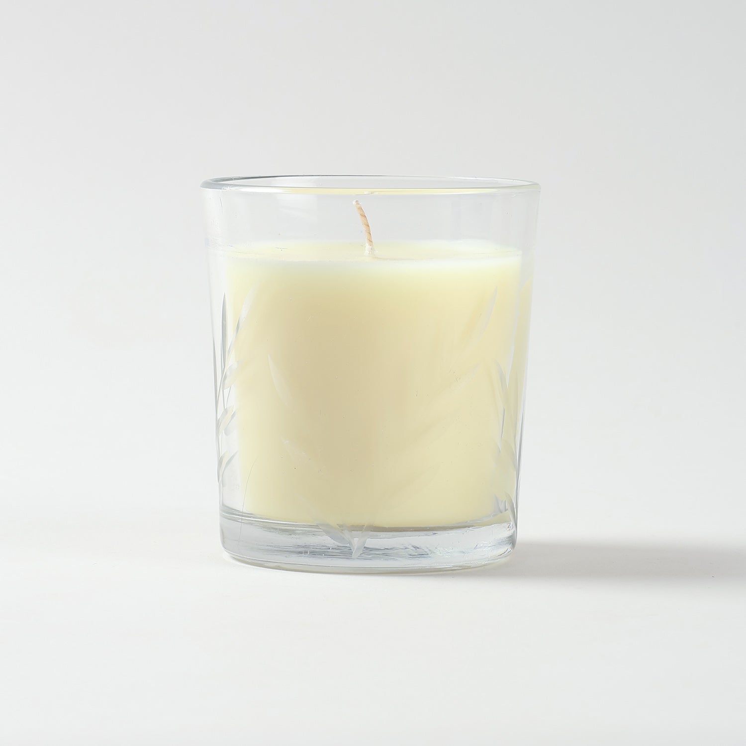 Jasmine scented soy candle in a decorative white glass jar for home fragrance and ambience