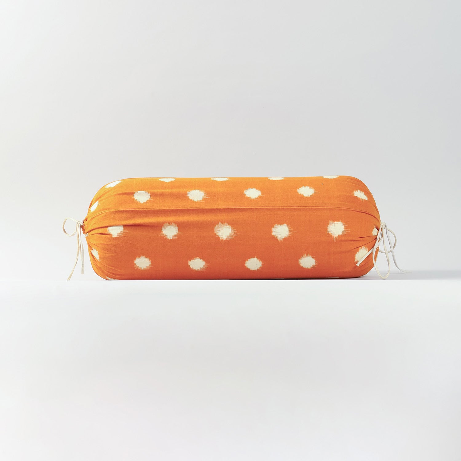 Single mustard handwoven cotton bolster cover designed for sofas, beds, and decorative seating arrangements