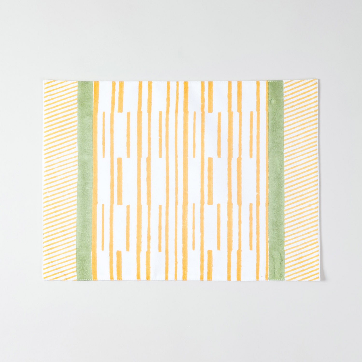 Full size cotton table mat featuring orange striped pattern with decorative green panel borders