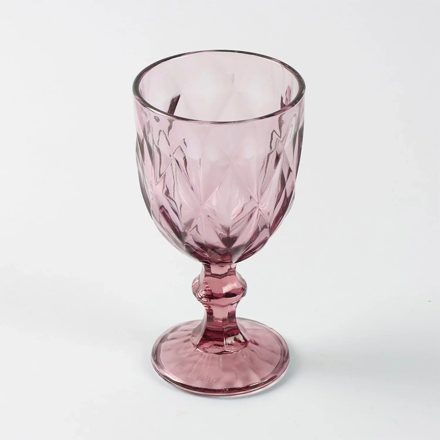 Front view of a single pink diamond wine glass, highlighting shape finish and handcrafted detailing