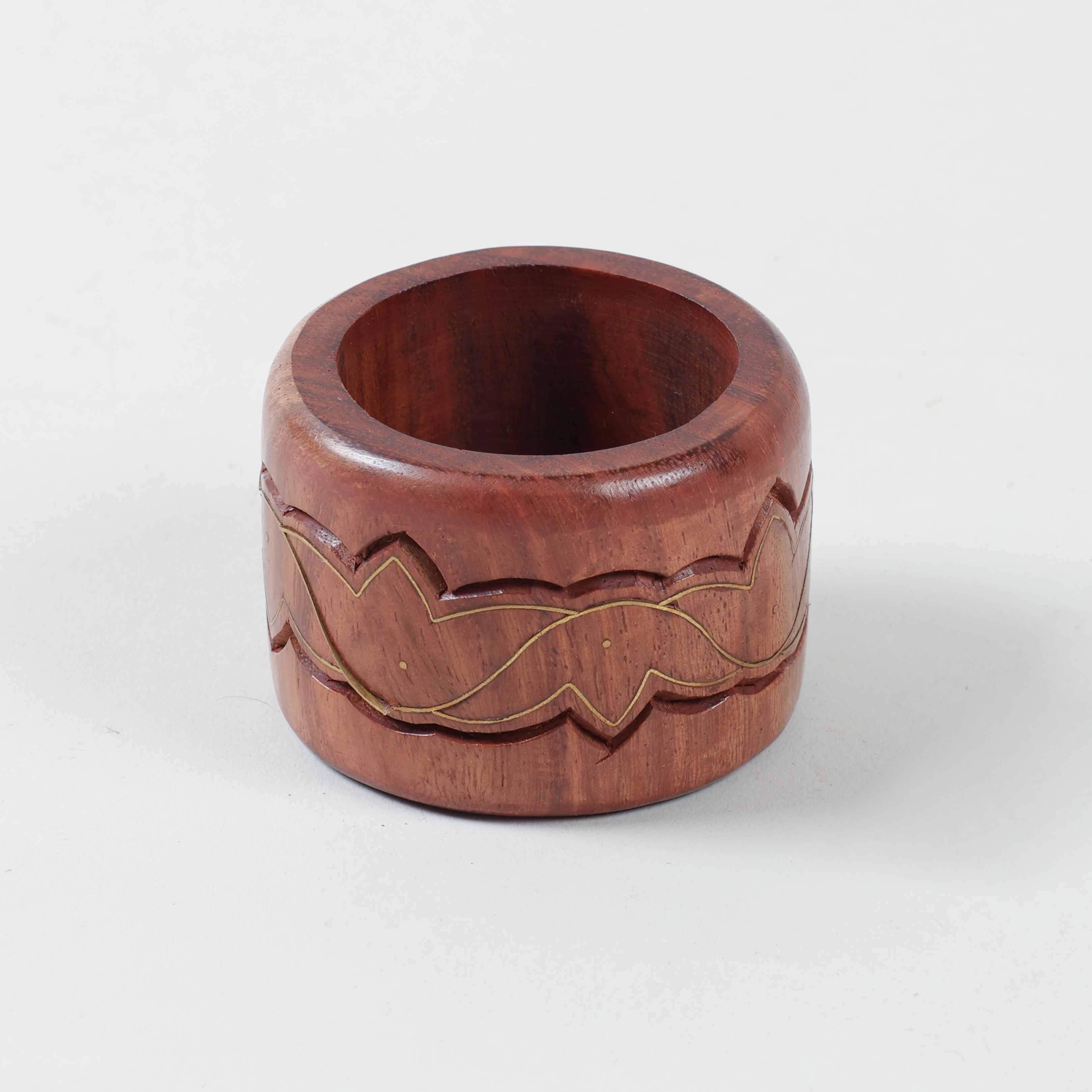 Round wooden napkin ring decorated with lotus motifs brass inlay crafted using traditional Tarkashi art