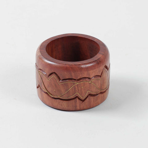 Round wooden napkin ring decorated with lotus motifs brass inlay crafted using traditional Tarkashi art