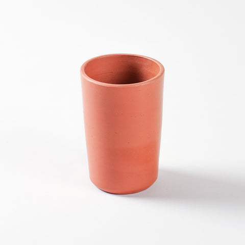 Single handmade terracotta tumbler crafted from natural clay for ecofriendly everyday drinkware