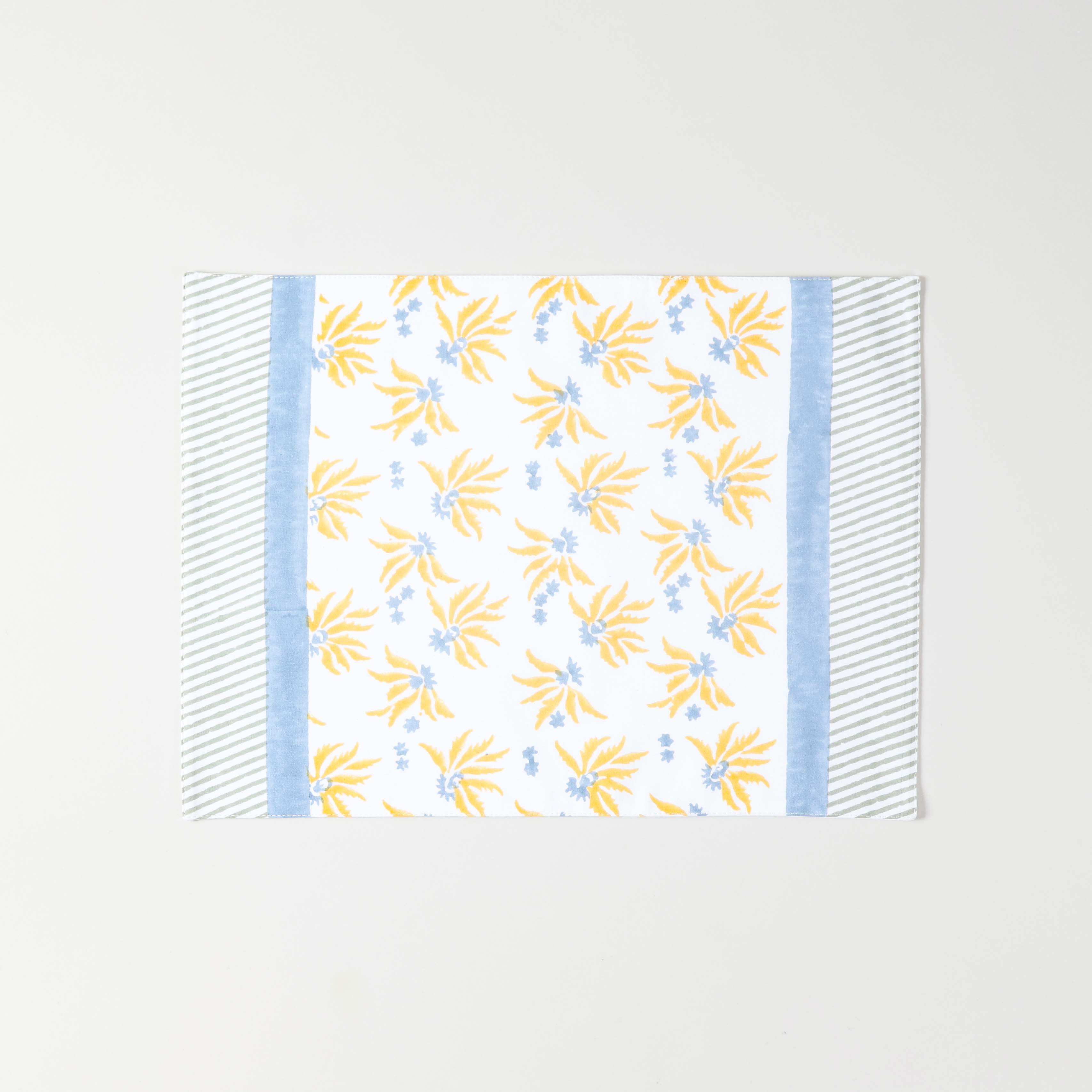 Full size cotton placemat featuring yellow floral block print with blue border detailing