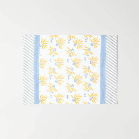 Full size cotton placemat featuring yellow floral block print with blue border detailing