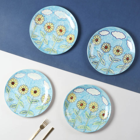 Hand-painted Sunflower ceramic dinner plate set of 4 featuring a light blue background and vibrant sunflower motifs, styled for elegant table settings