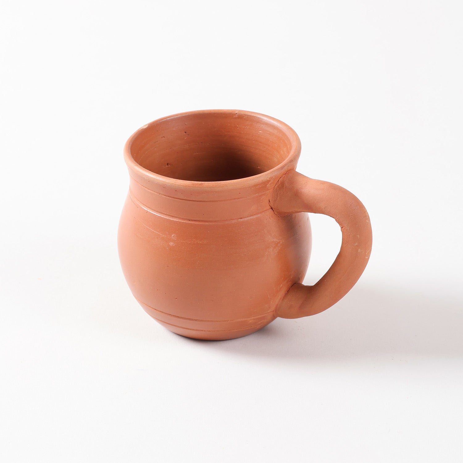 Single terracotta tea cup handcrafted from natural clay, ideal for serving tea, coffee, and traditional kullad chai